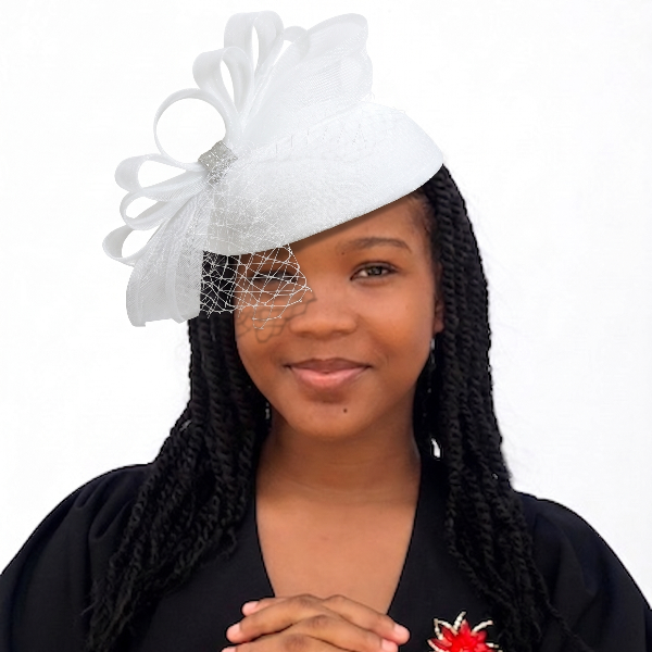 Woman wearing a white decorative headpiece with a veil on a white background
