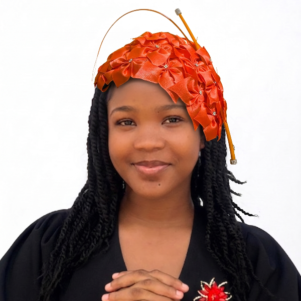 Woman wearing a decorative orange headpiece with a white background