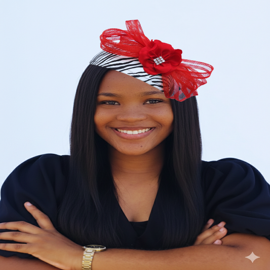 Woman wearing a zebra print half base church hat with a red bow against a white background