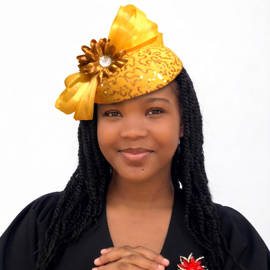 Woman wearing a decorative yellow headpiece with a black background