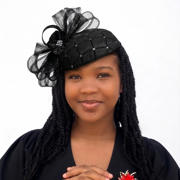 Woman wearing a black hat with decorative elements on a white background