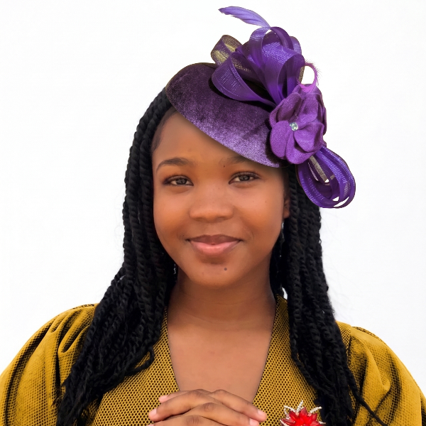 Woman wearing a purple headpiece and yellow top with a white background