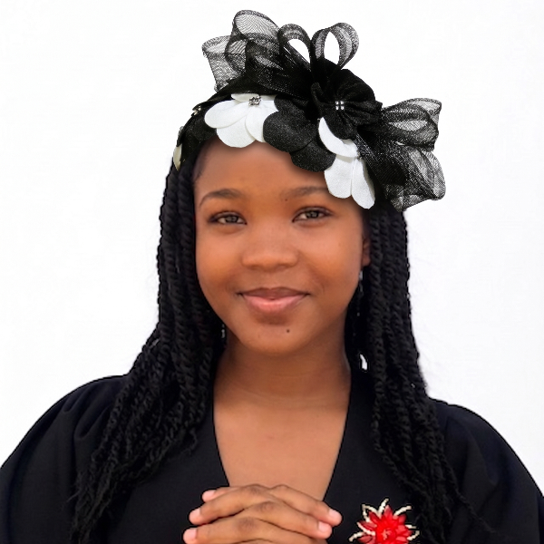 Woman with braided hair wearing a black headband with flowers on a white background