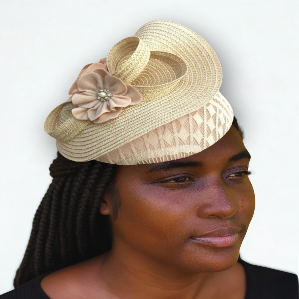 Woman wearing a decorative headpiece with a flower on a plain background