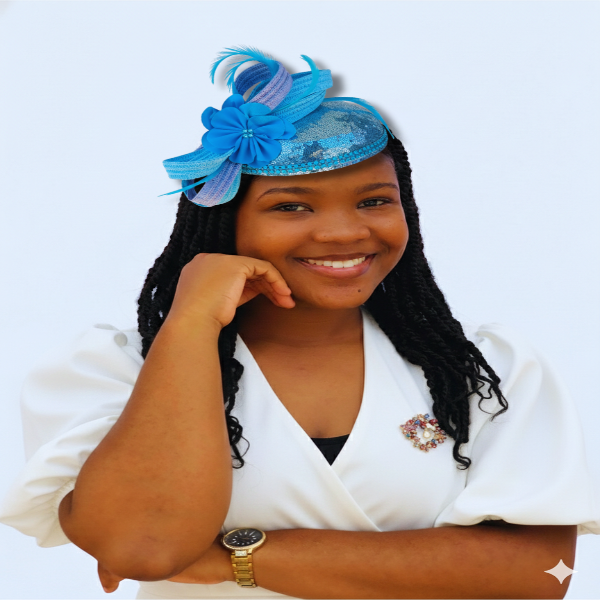 Woman wearing a blue headpiece with feathers on a white background