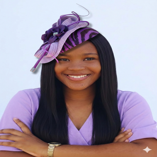 Young woman wearing a purple hat with a floral design against a light blue background