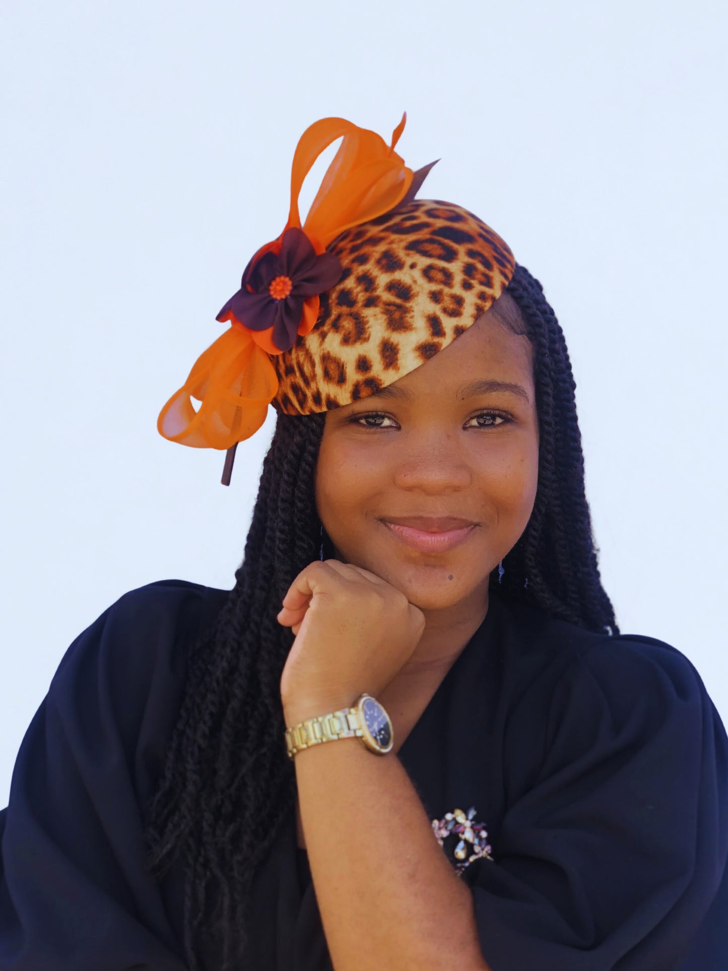 Leopard Print Fascinator Hat with Orange Bow – Bold & Elegant Church Headwear